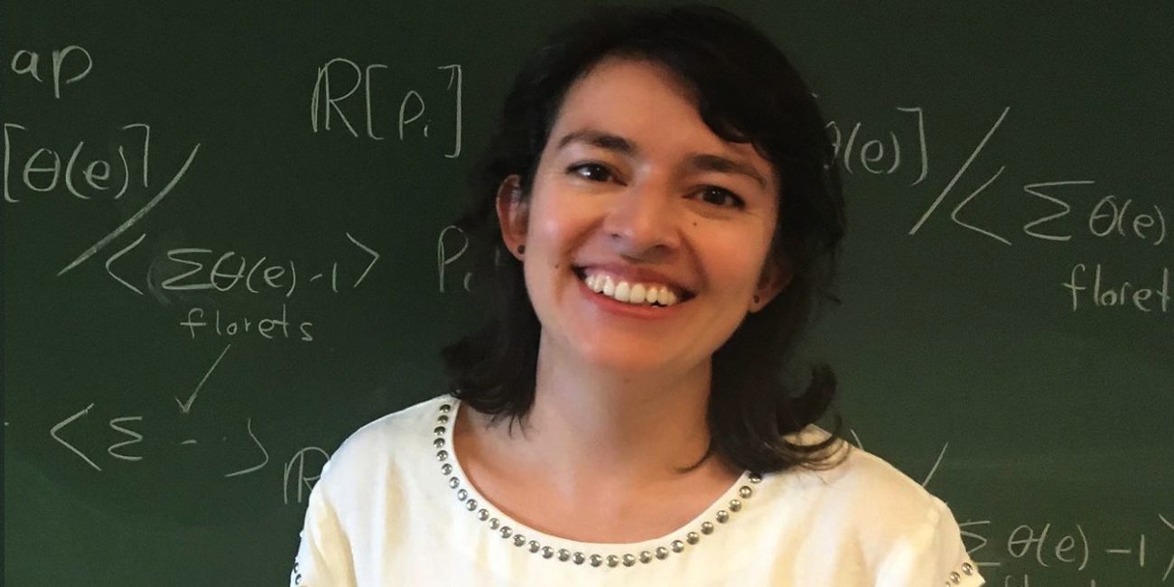 Eliana Duarte at a blackboard